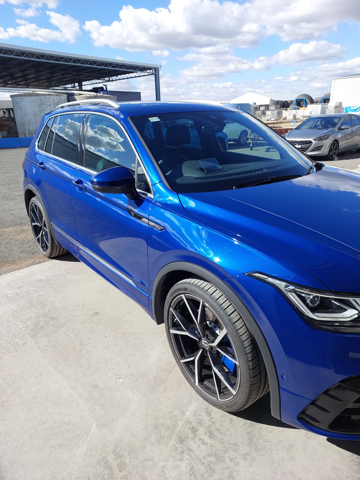 Blue Volkswagen Tiguan R parked on the concrete apron outside the Leeton workshop